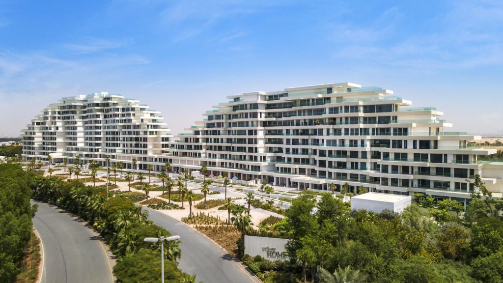 Exterior view of The Lofts Dubai – low-rise building in Al Barari with landscaped gardens